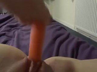 Girlfriend with carotte in pussy